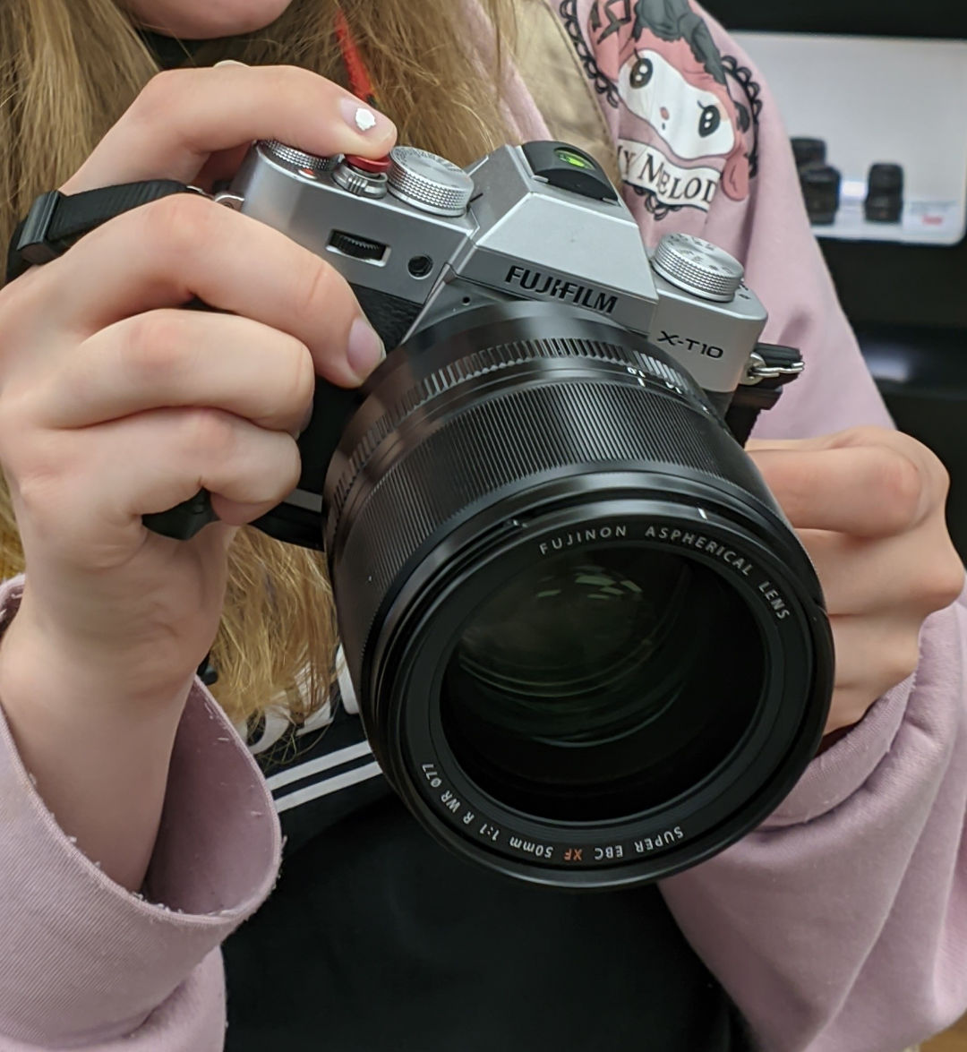 gigantic barrel shaped lens dwarfing our camera.