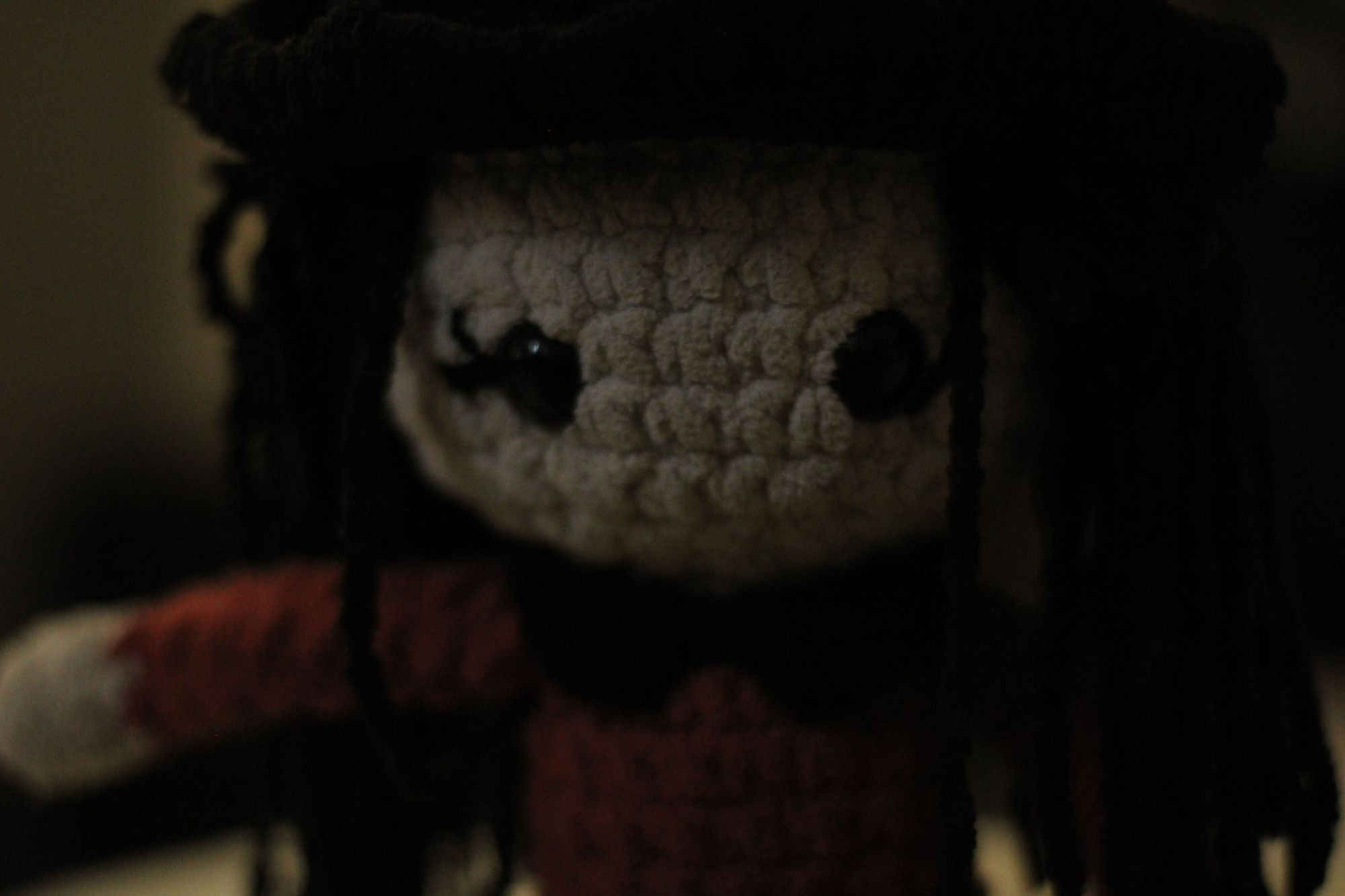 close up of a doll face in moody lighting